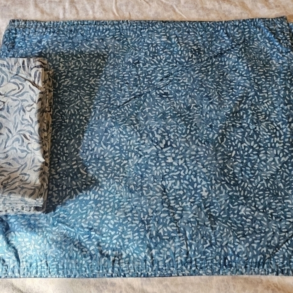 Four handmade batik placemats and napkins.